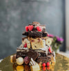Valentine’s Day Brownie Tower with layered brownies, candy, and cookies decorated with heart-shaped treats